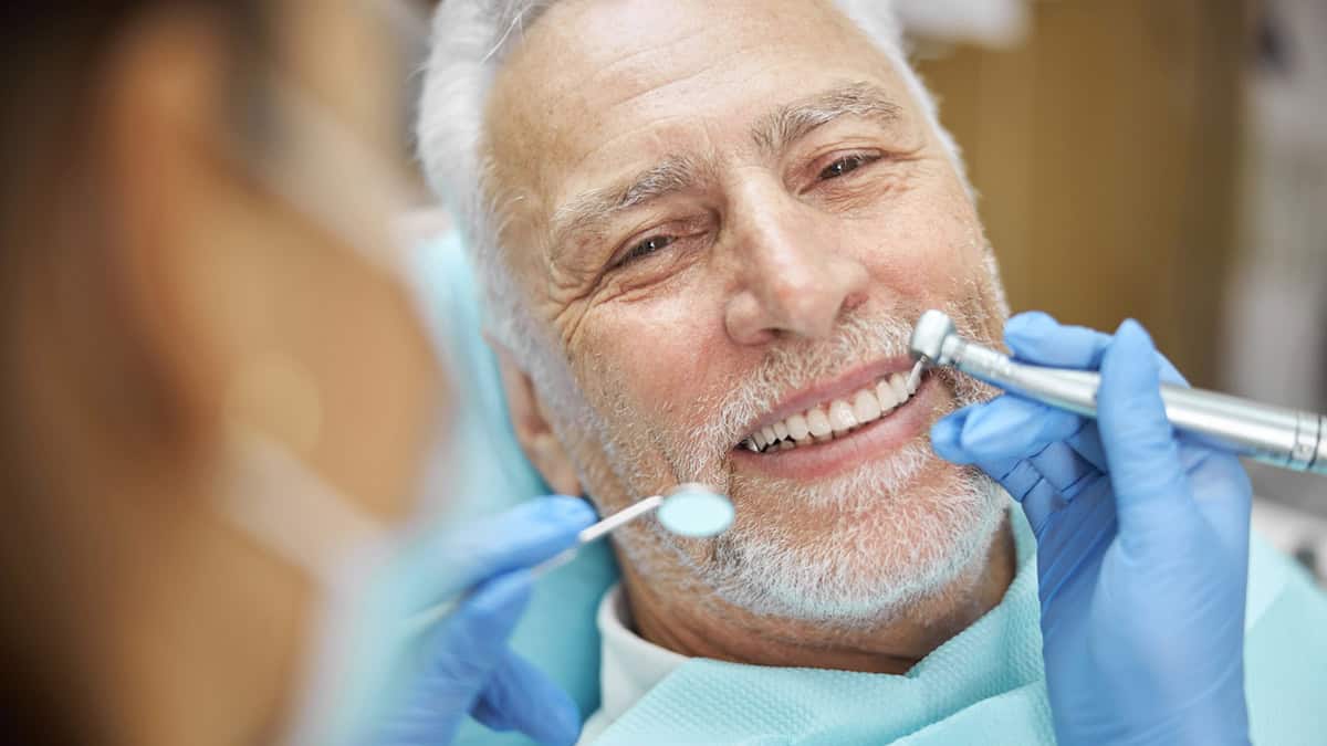 Mature person having dental exam